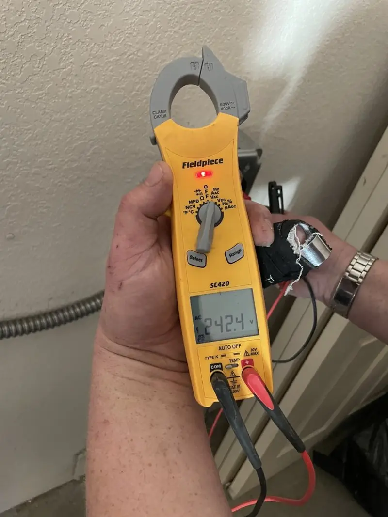 Voltage testing with clamp meter during Ceiling Fan Installation in Middletown
